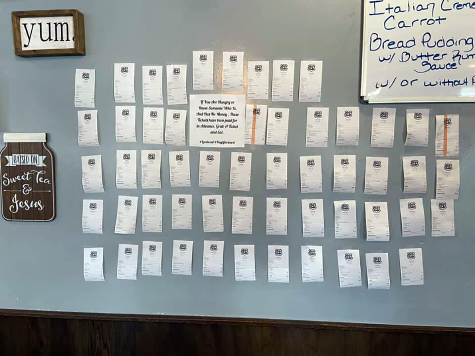 In this Feb. 5, 2021, photo provided by Zack's Cafe, receipts for pre-paid meals hang on the wall inside Zack's Cafe in Miami, Okla. Customers pay for them so that people in need, many of them struggling financially due to the coronavirus pandemic, can get a meal, judgment-free and no questions asked. (Zack's Cafe via AP)