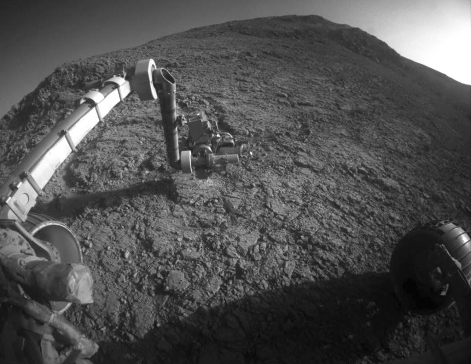 This Jan. 5, 2016 photo made available by NASA shows the tool turret at the end of the the Opportunity rover's robotic arm on the southern side of "Marathon Valley," which goes through the western rim of Endeavour Crater. (NASA/JPL-Caltech via AP)