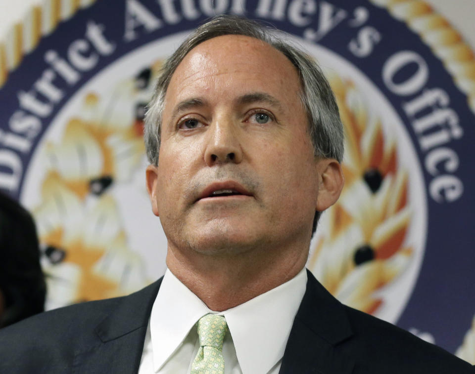 FILE - In this June 22, 2017, file photo, Texas Attorney General Ken Paxton speaks at a news conference in Dallas. Records reviewed by The Associated Press show that an exclusive group of Texans stood to benefit when Paxton, urged a small Colorado county to reverse a public health order during the coronavirus outbreak. Paxton this month told Gunnison County that banning Texans from their property in Colorado during the outbreak was unconstitutional. (AP Photo/Tony Gutierrez, File)