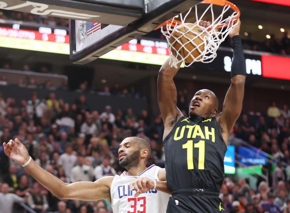 Utah Jazz guard <a class="link " href="https://sports.yahoo.com/nba/players/5636" data-i13n="sec:content-canvas;subsec:anchor_text;elm:context_link" data-ylk="slk:Kris Dunn;sec:content-canvas;subsec:anchor_text;elm:context_link;itc:0">Kris Dunn</a> (11) dunks on LA Clippers forward Nicolas Batum (33) in Salt Lake City on Friday, Oct. 27, 2023. The Jazz won 120-118. | Jeffrey D. Allred, Deseret News