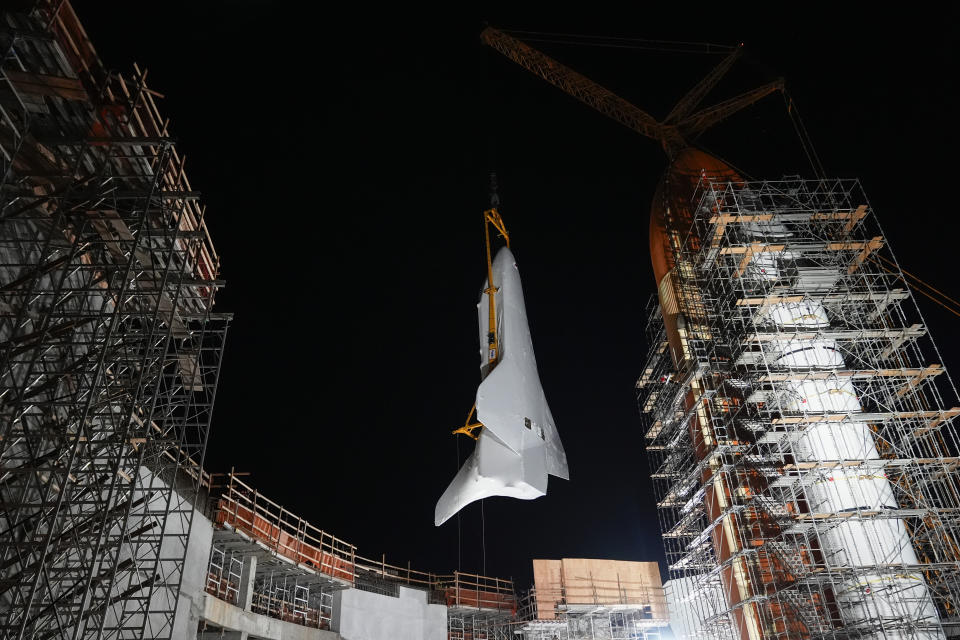 Space Shuttle Endeavour is lifted into the site of the future Samuel Oschin Air and Space Center on Tuesday, Jan. 30, 2024, in Los Angeles. (AP Photo/Ashley Landis)