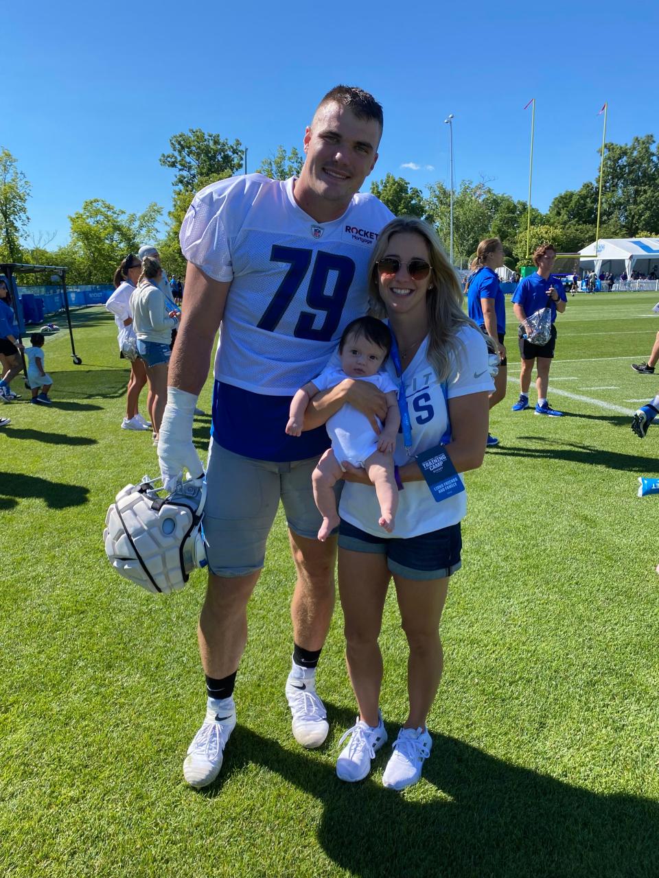 Lions defensive lineman John Cominsky with his wife and daughter.