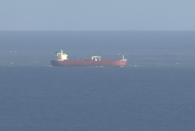 In this image taken from SKY video, shows a tanker at sea, as filmed from land on Sunday Oct. 25, 2020. British police are investigating an undisclosed incident aboard an oil tanker in the English Channel. The incident reportedly took place aboard the Libyan-registered oil tanker Nave Andromeda south of Sandown on Isle of Wight, according to Isle of Wight Radio. (SKY News via AP)