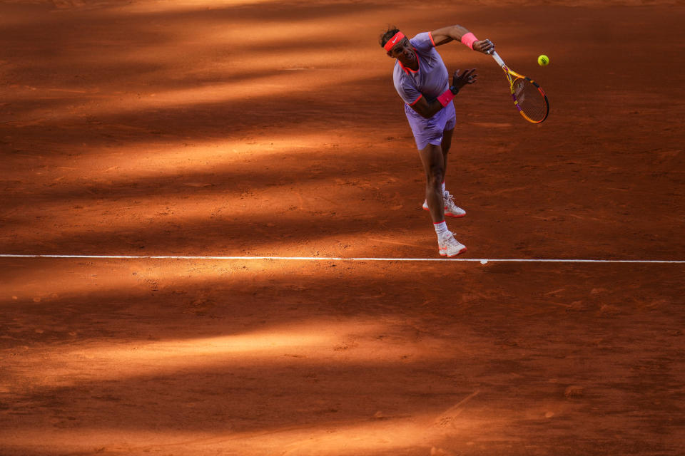 Rafael Nadal of Spain serves to Darwin Blanch of United States during the Mutua Madrid Open tennis tournament in Madrid, Thursday, April 25, 2024. (AP Photo/Manu Fernandez)