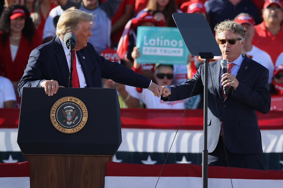 Sen. Rand Paul, right, gives a fist bump to then-President Donald Trump while praising the president during a campaign rally at Phoenix Goodyear Airport October 28, 2020, in Goodyear, Arizona. (Photo: Chip Somodevilla via Getty Images)