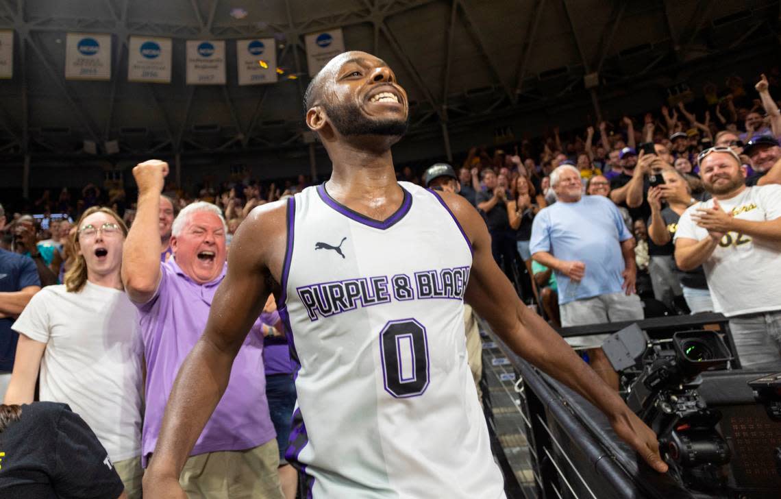 Jacob Pullen celebrates with fans after he hit a three-pointer against the Lone Star Legends to advance in The Basketball Tournament at Koch Arena on Friday night.