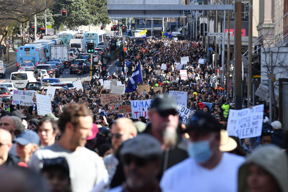 Anti lockdown protesters march along Broadway and George St in Sydney on Saturday.