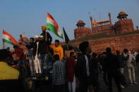 Farmers are seen inside the historic Red Fort, during a protest against farm laws on the occasion of India's Republic Day, in New Delhi, India on January 26, 2021. The national capital witnessed violent scenes as farmers clashed with the police, broke barricades and stormed the Red Fort, and the police responded with tear gases and lathi charge. (Photo by Mayank Makhija/NurPhoto via Getty Images)