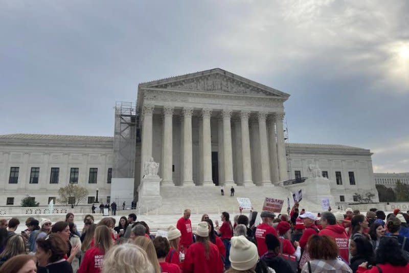 Hundreds of gun safety advocates rally in front of the U.S. Supreme Court on Tuesday, calling for justices to uphold the federal law that prohibits individuals facing restraining orders in domestic violence cases from possessing firearms. Photo by Cate Bikales/Medill News Service