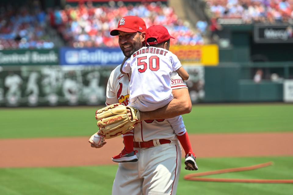 Adam Wainwright with his son Caleb at Busch Stadium in June.