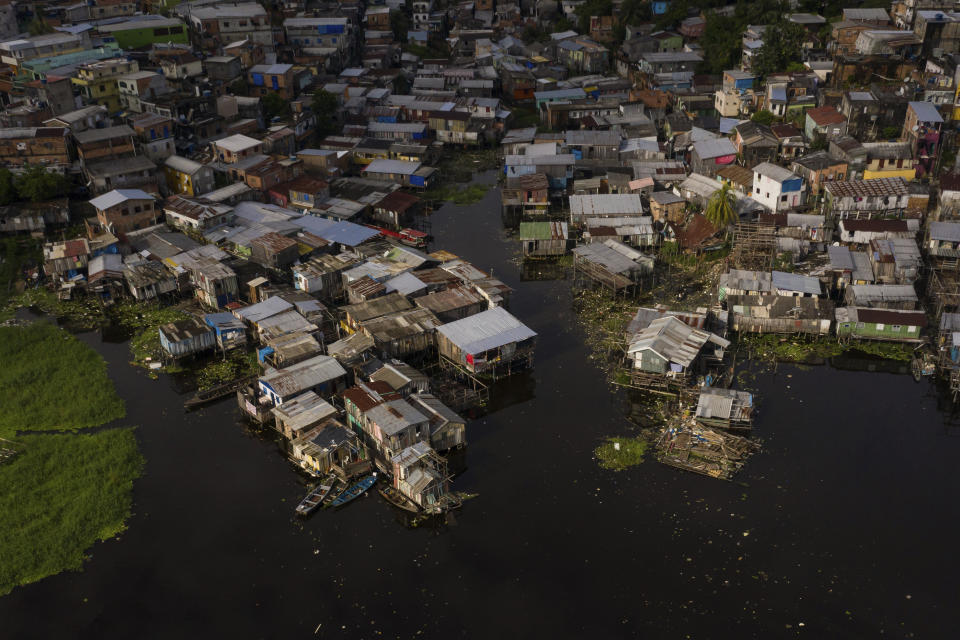 The riverside Educandos neighborhood is seen from above in Manaus, Brazil, Saturday, May 16, 2020. Per capita, Manaus is Brazil's major city hardest hit by COVID-19. (AP Photo/Felipe Dana)