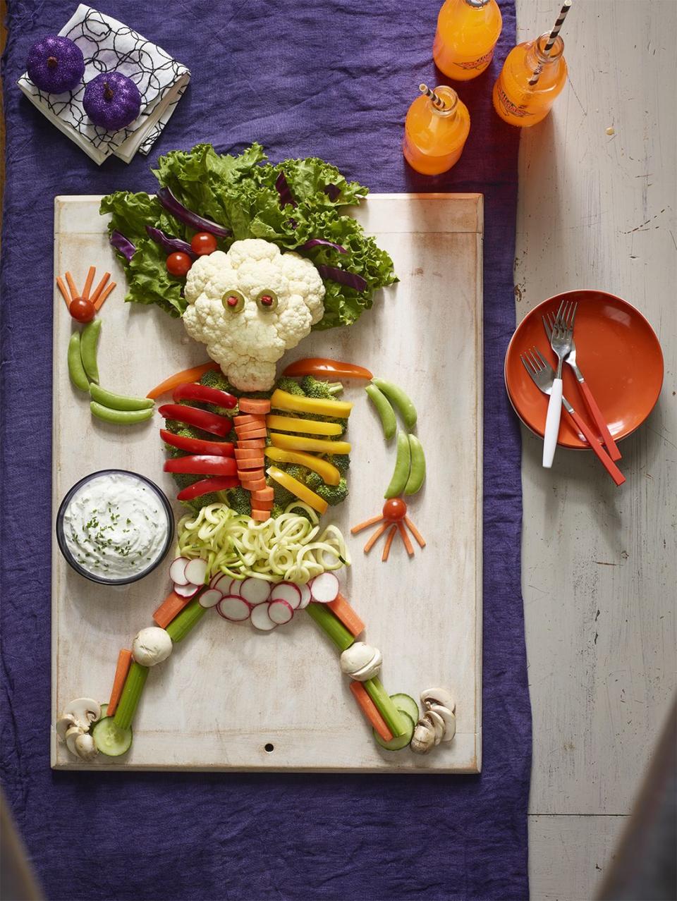 <p>This adorable idea won't take anytime at all. Just arrange your favorite veggies into the shape of skeleton. Don't forget the dip! </p>