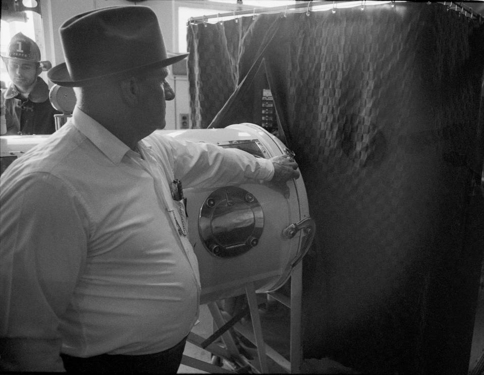 Bill Ashley, who was confined to an iron lung, voted at Stonestreet Elementary School in Valley Station. Two Jefferson county election officials went into the voting booth to pull the levers for him.  By Charles Fentress Jr., The Courier-Journal. Nov. 5, 1968