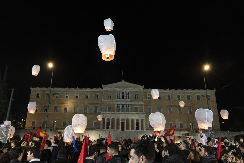 Demonstrators release lanterns during a protest in front of the parliament, in Athens, Saturday, March 4, 2023. Supporters of the Greek Communist party gathered to protest the deaths of dozens of people late Tuesday, in Greece's worst recorded rail accident. (AP Photo/Yorgos Karahalis)