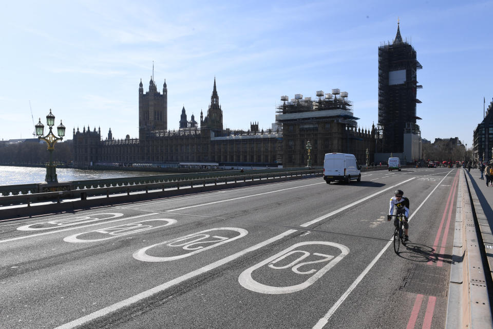A near empty Westminster Bridge and the Houses of Parliament in Westminster, London, the day after Prime Minister Boris Johnson put the UK in lockdown to help curb the spread of the coronavirus.