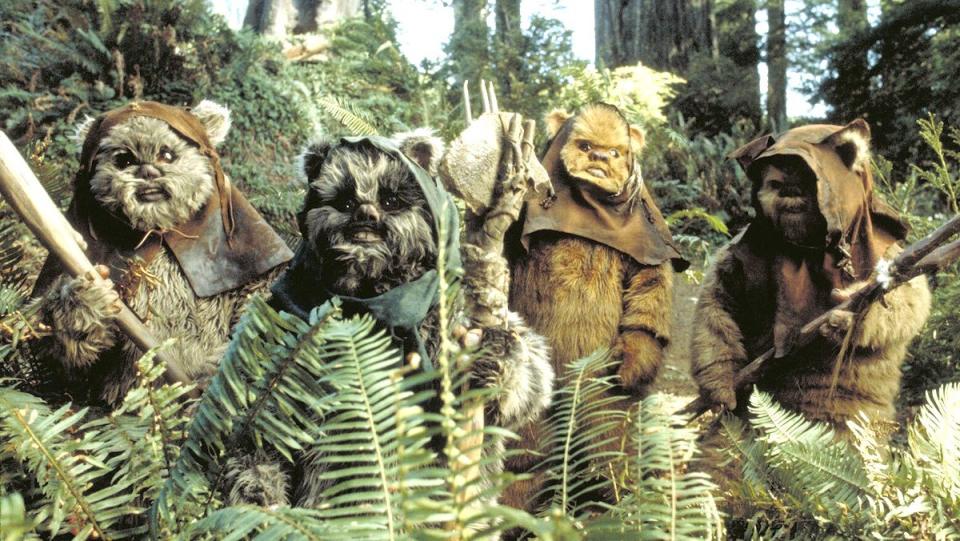Four Ewoks out in the grass in Return of the Jedi
