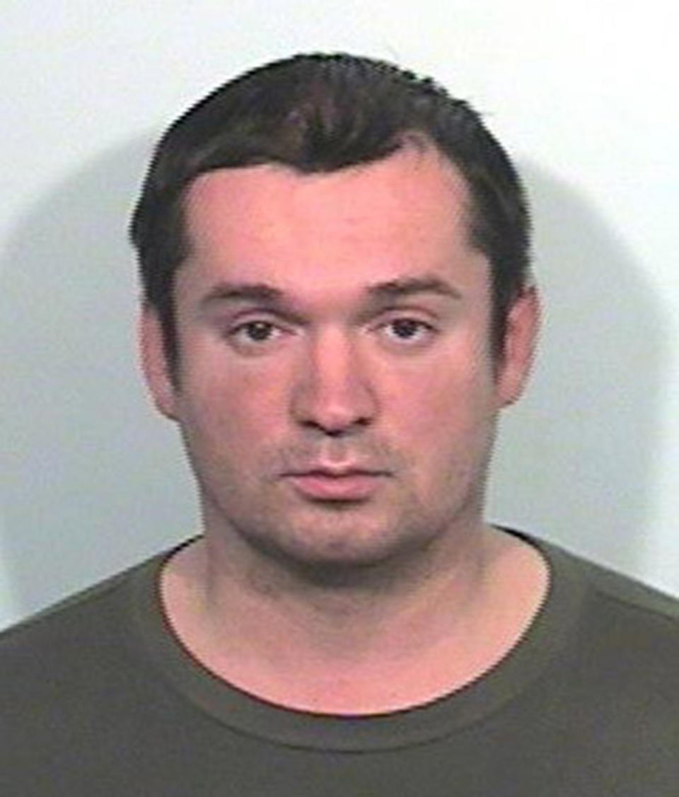 This undated photo made available by the Lake County Sheriff's Office shows Igor Karlukov of Palatine, Ill. Karlukov was convinced an evil spirit had taken control of his ex-girlfriend in 2014 and that he needed to eradicate it before his soul was stolen. The troubled 35-year-old was arrested for forcing his way into her apartment and brought to Lake County Jail, just north of Chicago. Karlukov fashioned a makeshift noose out of a mesh laundry bag and fatally hanged himself from a heating vent. (Lake County Sheriff's Office/Daily Herald via AP)