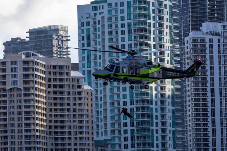 A Miami-Dade Fire-Rescue helicopter approaches a boat to perform a rescue during a South Florida Public Safety Regional Assets in Action Demonstration showcasing an active threat response incident in Biscayne Bay as part of the annual 2024 National Homeland Security Conference at PortMiami, Terminal J on Wednesday, July 24, 2024, in Miami, Fla.