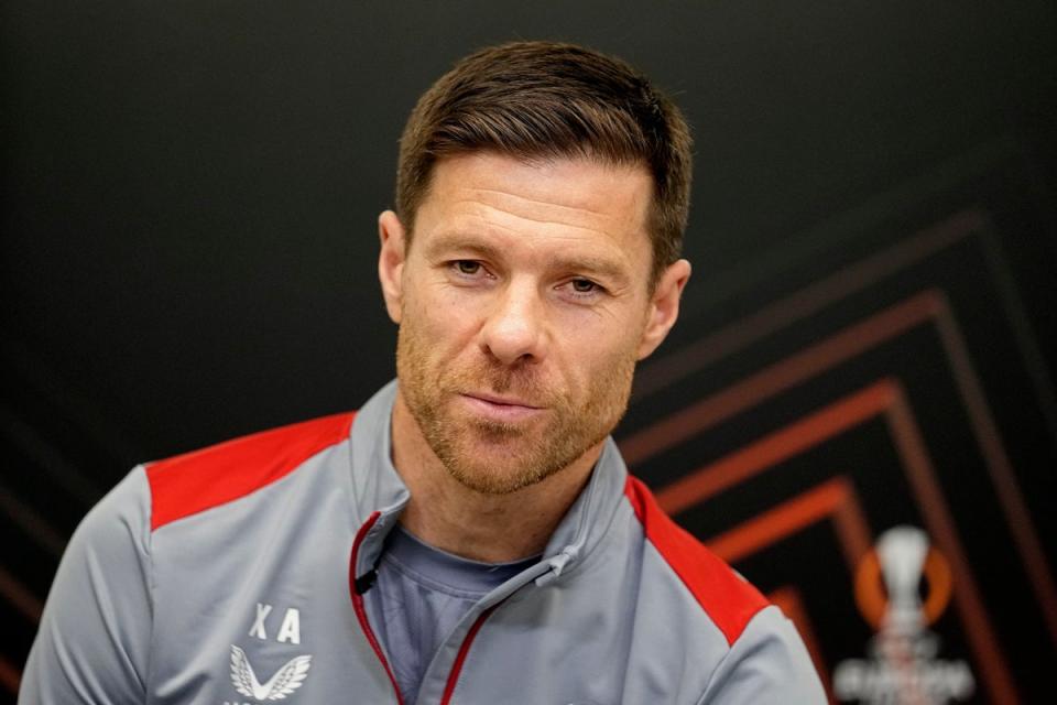 Leverkusen manager Xabi Alonso could yet the Europa League trophy to his Bundesliga crown (AP)