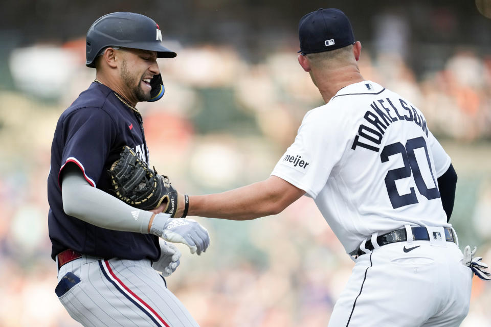 Detroit Tigers first baseman Spencer Torkelson (20) tags Minnesota Twins' Royce Lewis out in the second inning of a baseball game, Saturday, June 24, 2023, in Detroit. (AP Photo/Paul Sancya)