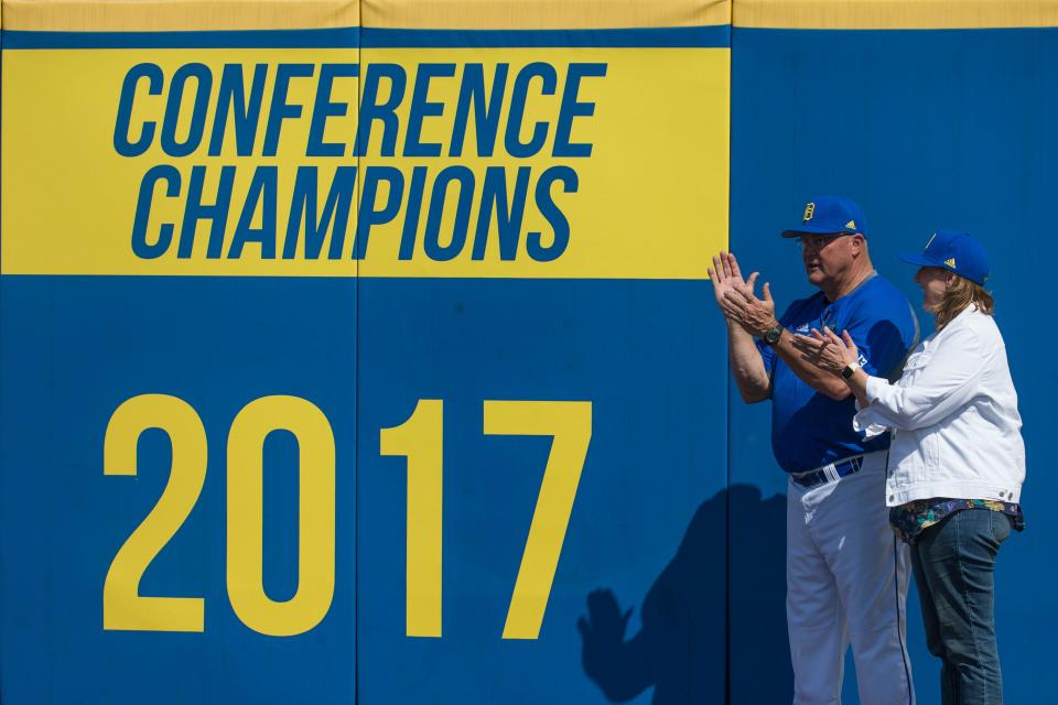 Delaware baseball head coach Jim Sherman and athletic director Chrissi Rawak unveil signage in the outfield recognizing Delaware's 2017 Colonial Athletic Association conference championship.