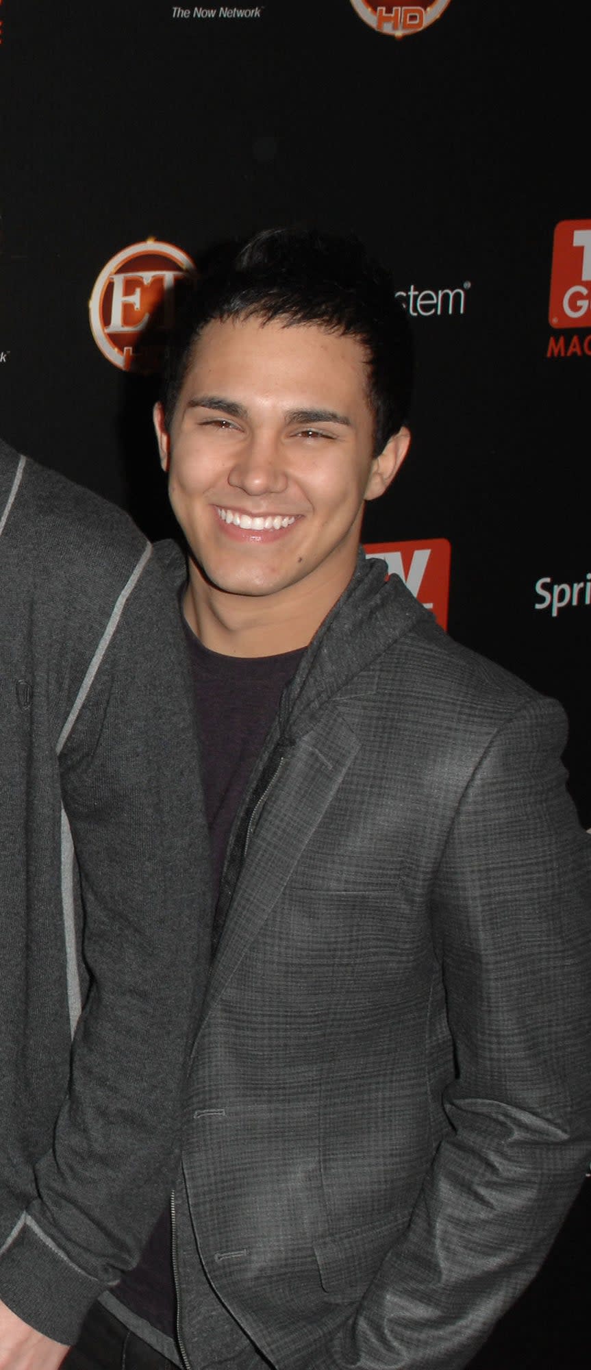 Carlos Pena posing for Big Time Rush photo