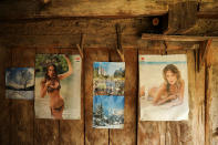 <p>Posters and calendars are seen outside of an abandoned house in the empty village of Repusnica, near the southeastern town of Knjazevac, Serbia, Aug. 14, 2017. (Photo: Marko Djurica/Reuters) </p>