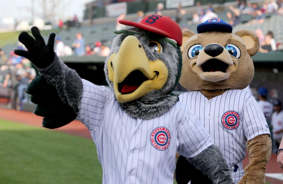 South Bend Cubs mascots Swoop and Stu wave to the crowd Tuesday, April 11, 2023, at Four Winds Field for the 2023 season home opening baseball game against Beloit.