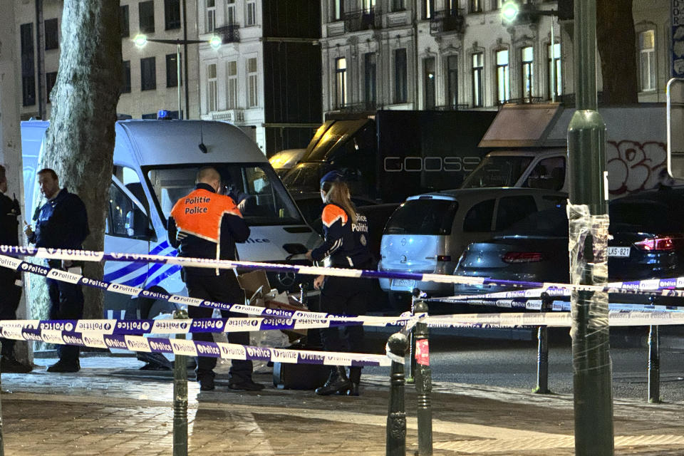 A police tape cordones off the scene of a shooting in Brussels, Sunday, Feb. 11, 2024. The grim picture of violent crime related to drugs is becoming increasingly visible in Europe's capital city. Drug dealers have recently fought in the heart Brussels for several days, leaving in their wake one dead and others injured. (AP Photo/Sylvain Plazy)