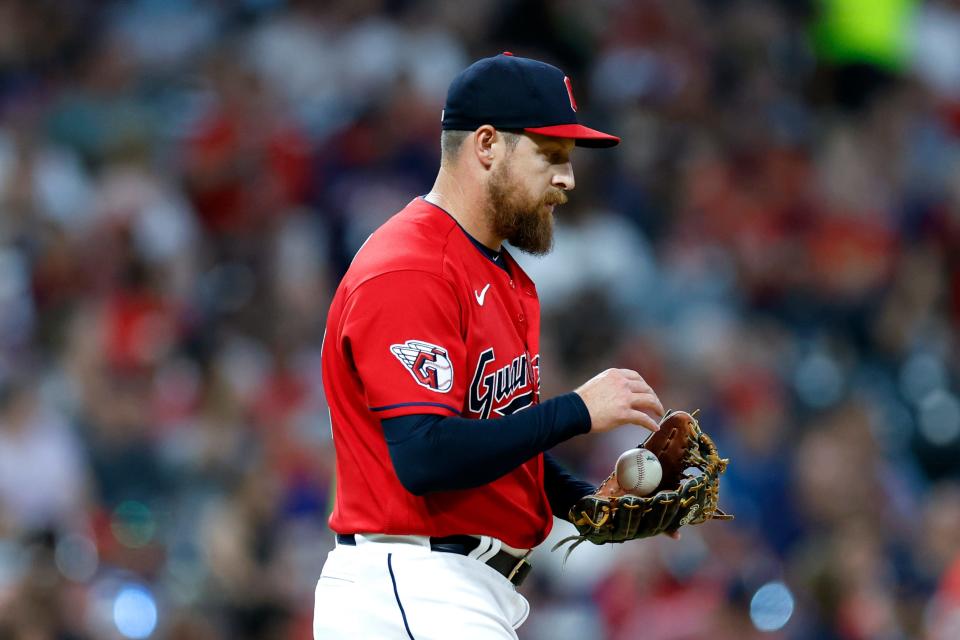 Guardians relief pitcher Bryan Shaw walks back to the mound after giving up a two-run home run to Boston Red Sox infielder Christian Arroyo in the seventh inning of Friday night's game in Cleveland. The Red Sox won 6-3. [Ron Schwane/Associated Press]