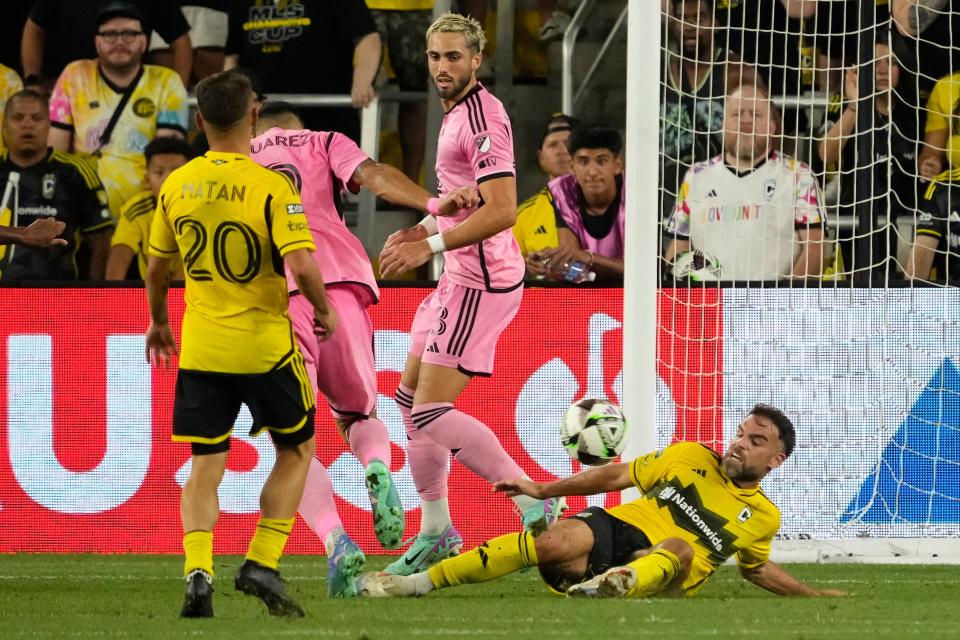 Aug 13, 2024; Columbus, Ohio, USA; Columbus Crew defender Rudy Camacho (4) stops a shot from Inter Miami CF forward Luis Suarez (9) during the second half of the Leagues Cup round of 16 game at Lower.com Field. The Crew won 3-2.