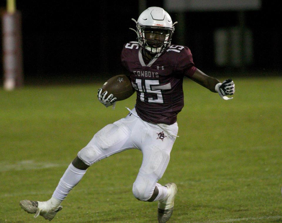Madison County junior wide receiver Varian Terry (15) rushes the ball in a game against Wakulla on Aug. 20, 2022, at Boot Hill. The Cowboys won, 25-14.