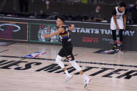 Denver Nuggets' Michael Porter Jr. (1) celebrates after making a 3-pointer against the Los Angeles Clippers during the second half of an NBA conference semifinal playoff basketball game Sunday, Sept. 13, 2020, in Lake Buena Vista, Fla. (AP Photo/Mark J. Terrill)