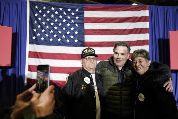 Dave McCormick, second from right, a Republican candidate for U.S. Senate in Pennsylvania, meets with attendees during a campaign event in Coplay, Pa., Tuesday, Jan. 25, 2022. (AP Photo/Matt Rourke)