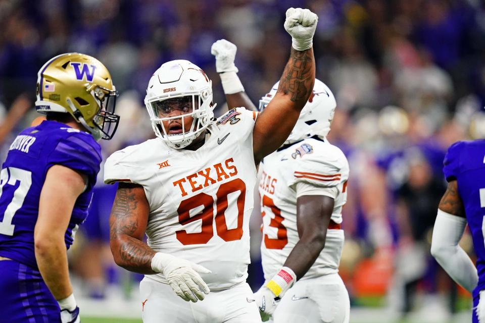 Jan 1, 2024; New Orleans, LA, USA; Texas Longhorns defensive lineman Byron Murphy II (90) celebrates after a play during the second quarter in the 2024 Sugar Bowl college football playoff semifinal game at Caesars Superdome. Mandatory Credit: John David Mercer-USA TODAY Sports