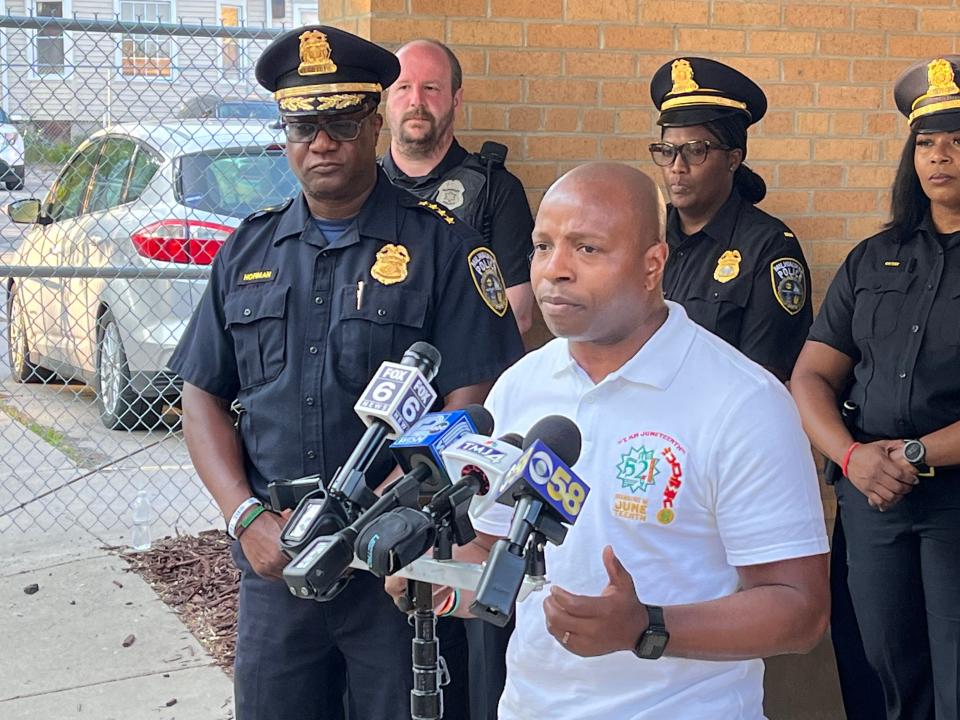 Milwaukee Mayor Cavalier Johnson and Milwaukee Police Chief Jeffrey Norman calls for an end to gun violence to settle petty disputes after a shooting that injured six people following the Juneteenth festival Monday. They spoke to news reporters outside the District 5 station, which is adjacent to the location of the shooting.