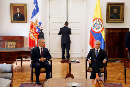 Colombian President Ivan Duque and his Chilean counterpart Sebastian Pinera look on during a meeting at La Moneda Palace in Santiago, Chile, March 21, 2019. REUTERS/Rodrigo Garrido