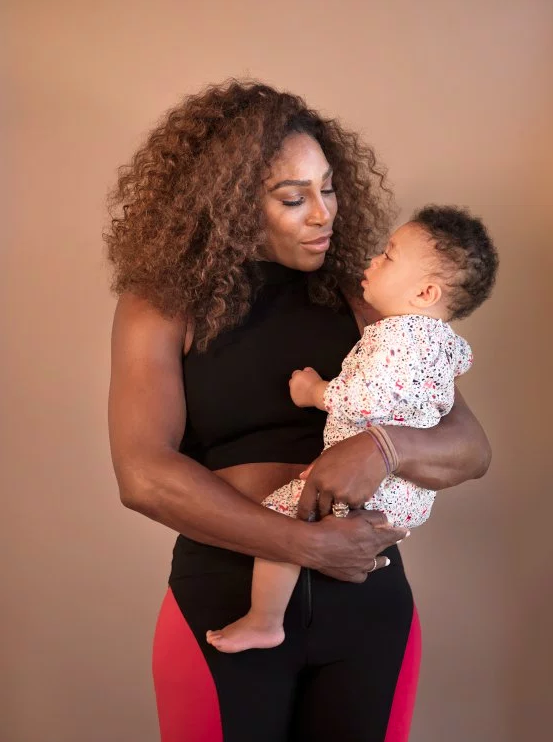 Serena, holding 11-month-old Olympia at their home outside of San Francisco