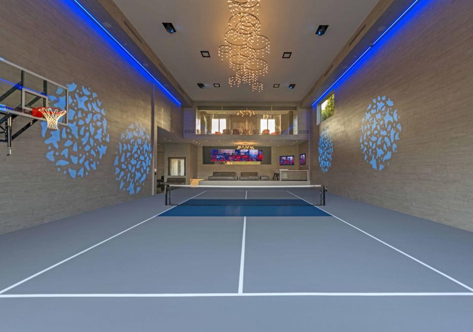 The home includes a sports complex with areas for basketball, paddle tennis/pickleball, weight training, cardio, and a boxing ring.