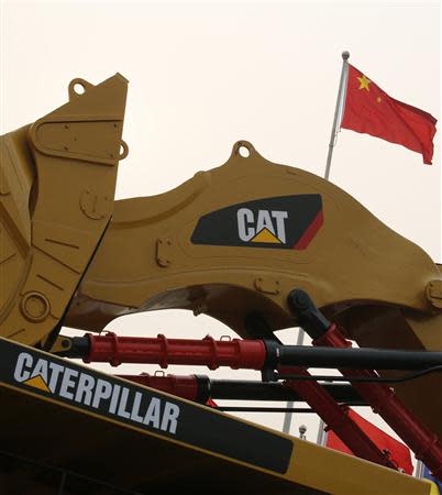 A Caterpillar excavator is displayed at the China Coal and Mining Expo 2013 in Beijing October 22, 2013. REUTERS/Kim Kyung-Hoon