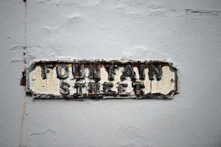 A sign for Fountain Street is seen in the walled-off loyalist Protestant enclave called The Fountain situated within the city of Londonderry, Northern Ireland, September 12, 2017. REUTERS/Clodagh Kilcoyne