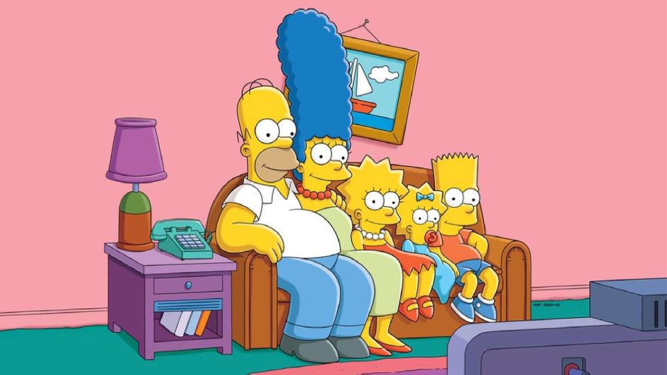 The Simpsons family sitting on a couch