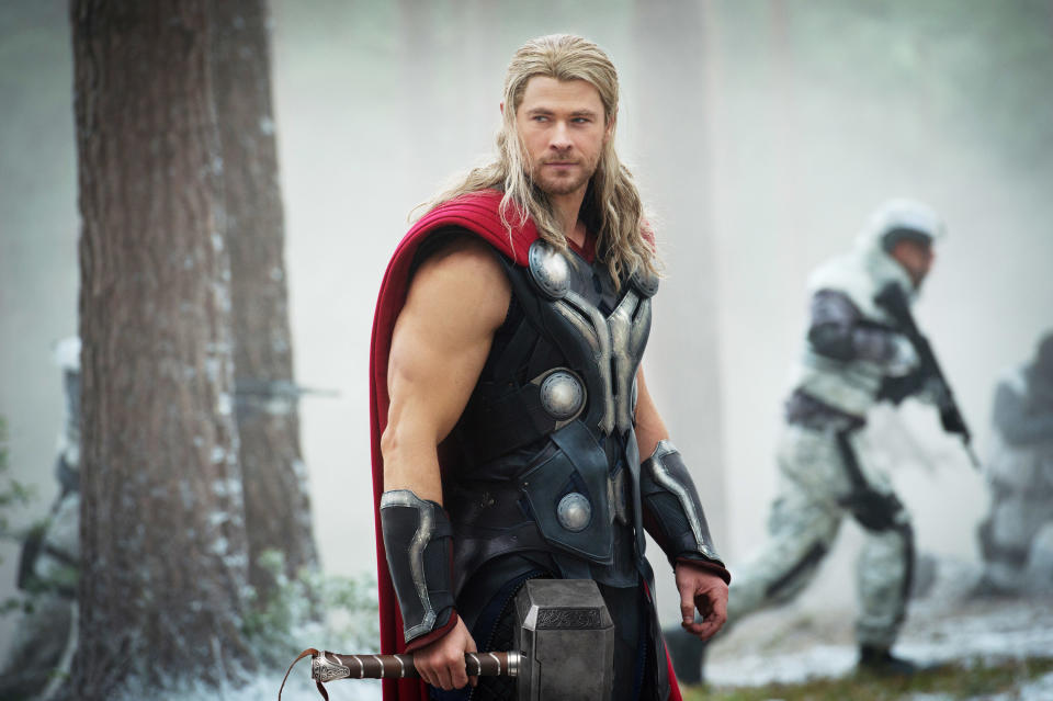 dressed in armor and a cape, Thor joins the fight, armed with Mjolnir