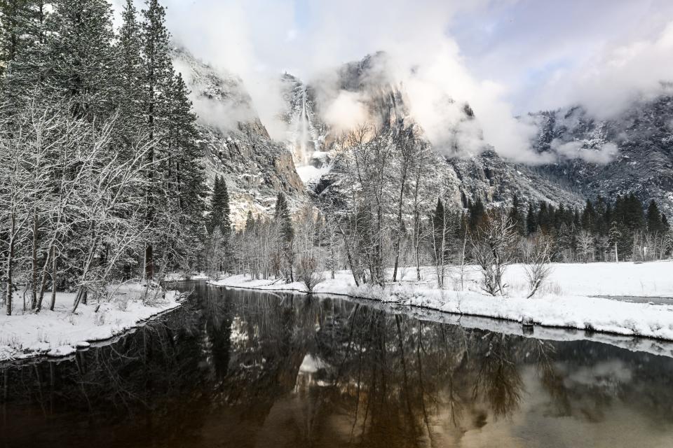 Yosemite falls is seen with reflection as snow blanked Yosemite National Park in California, United States on February 22, 2023.