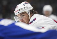 Washington Capitals' T.J. Oshie exchanges words with Vancouver Canucks' Brock Boeser before a faceoff during the second period of an NHL hockey game Tuesday, Nov. 29, 2022, in Vancouver, British Columbia. (Darryl Dyck/The Canadian Press via AP)