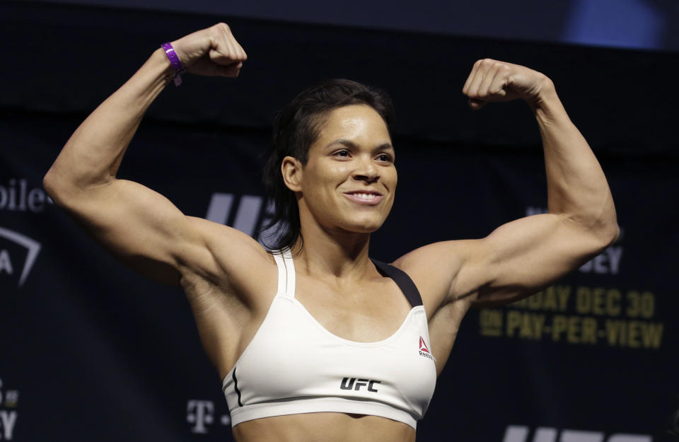 Amanda Nunes poses for photographers during an event for UFC 207, Thursday, Dec. 29, 2016, in Las Vegas. Nunes is scheduled to fight Ronda Rousey in a mixed martial arts women's bantamweight championship bout Saturday in Las Vegas. (AP Photo/John Locher)