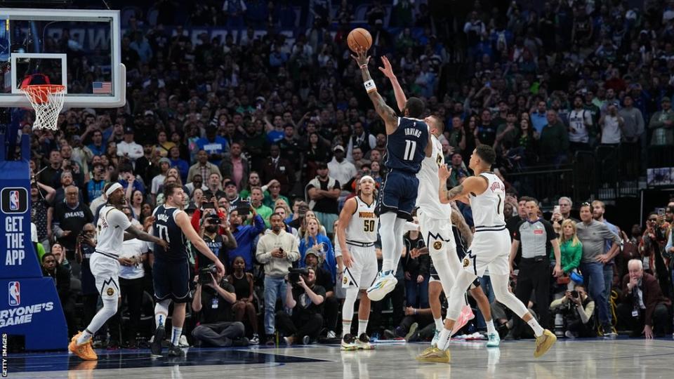 Dallas Mavericks guard Kyrie Irving releases the game-winning shot against the Denver Nuggets