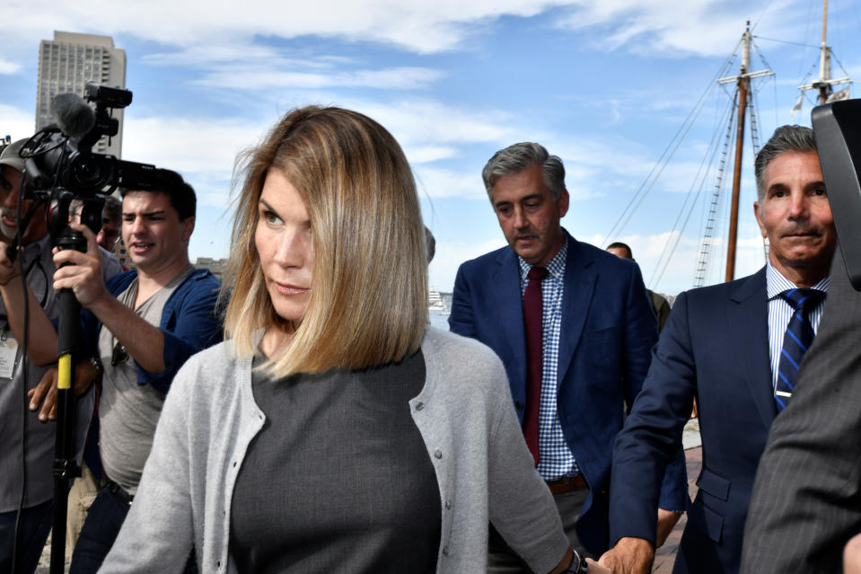 Actress Lori Loughlin, and her husband, fashion designer Mossimo Giannulli leave the federal courthouse after a hearing on charges in a nationwide college admissions cheating scheme in Boston, Massachusetts, U.S., August 27, 2019.  REUTERS/Josh Reynolds