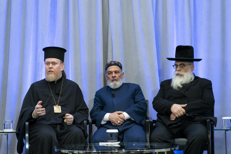 Archbishop Yevstratiy Zorya, left, speaks during a panel discussion among an interfaith delegation of Ukrainian religious leaders including Mufti Akhmed Tamim, center, and Rabbi Yaakov Dov Bleich, right, Monday, Oct. 30, 2023, at the U.S. Institute of Peace in Washington. (AP Photo/Stephanie Scarbrough)