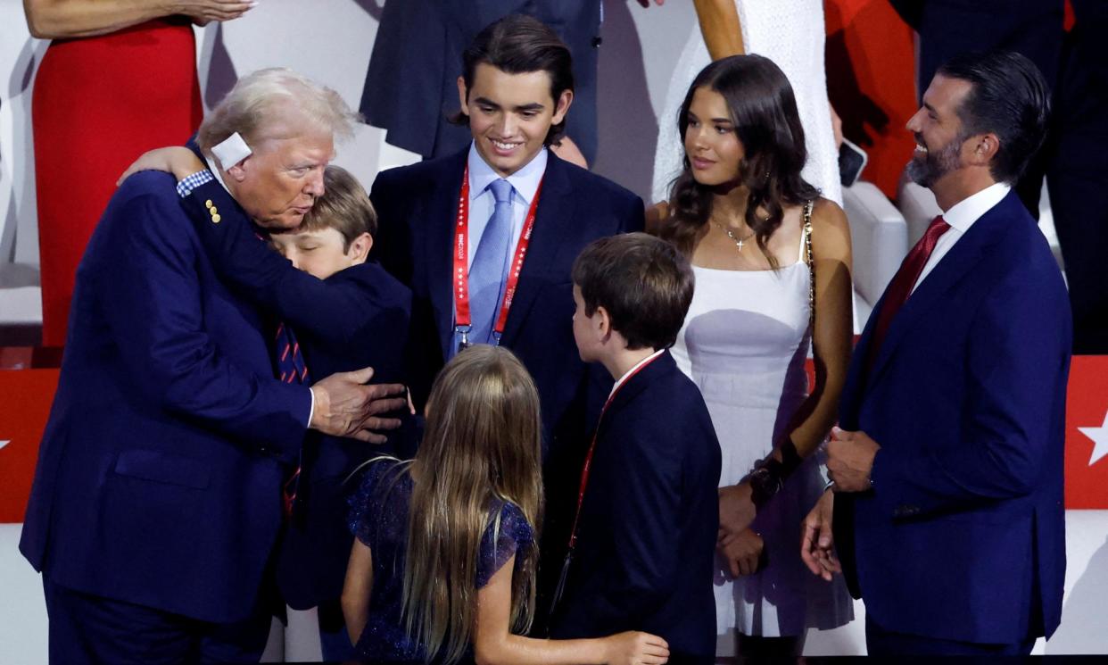 <span>Donald Trump interacts with his grandchildren and his son Don Jr at the Republican National Convention in Milwaukee, Wisconsin, on 17 July 2024.</span><span>Photograph: Marco Bello/Reuters</span>